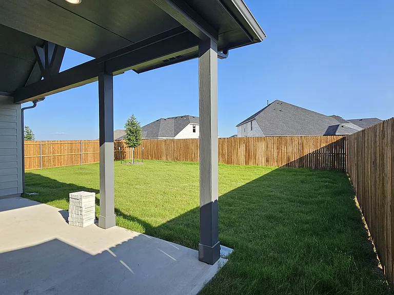 A large, private backyard with plenty of room for outdoor activities