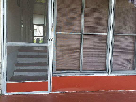 SCREENED PORCH ENTRY FROM DRIVEWAY