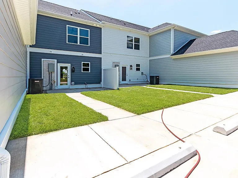 Backyard - 2 dedicated parking spot and white privacy fence