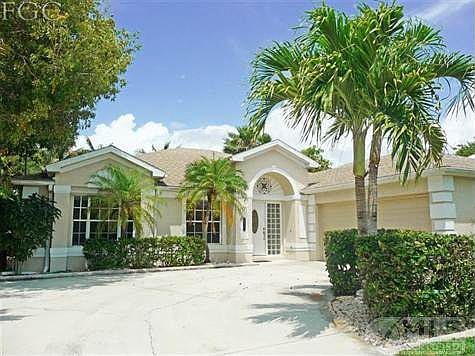 Front of home with very large driveway