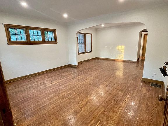 Living room opens into dining room