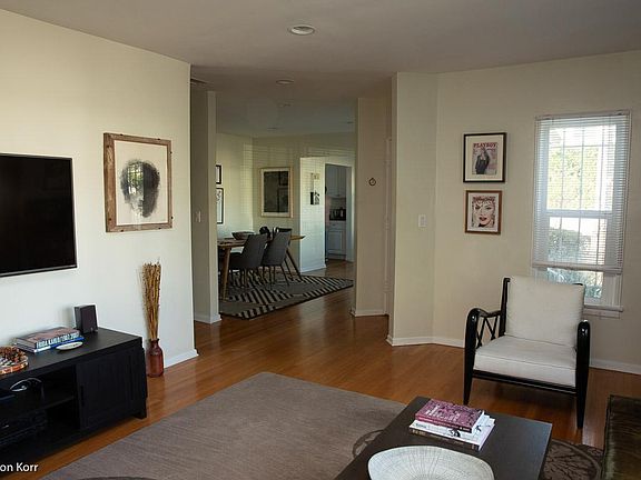 View Living through dining and breakfast area with sample furnishings (rented unfurnished)