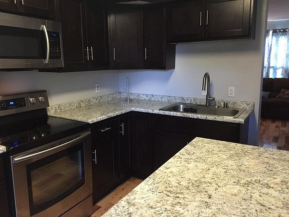 Open plan kitchen with island and space for a separate table