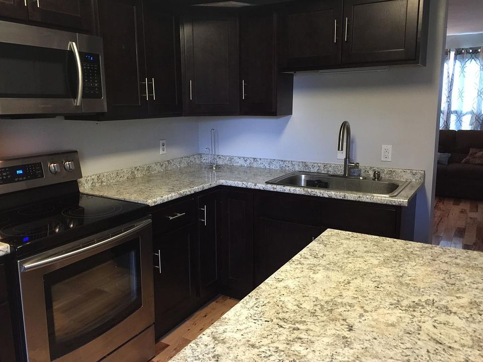 Open plan kitchen with island and space for a separate table