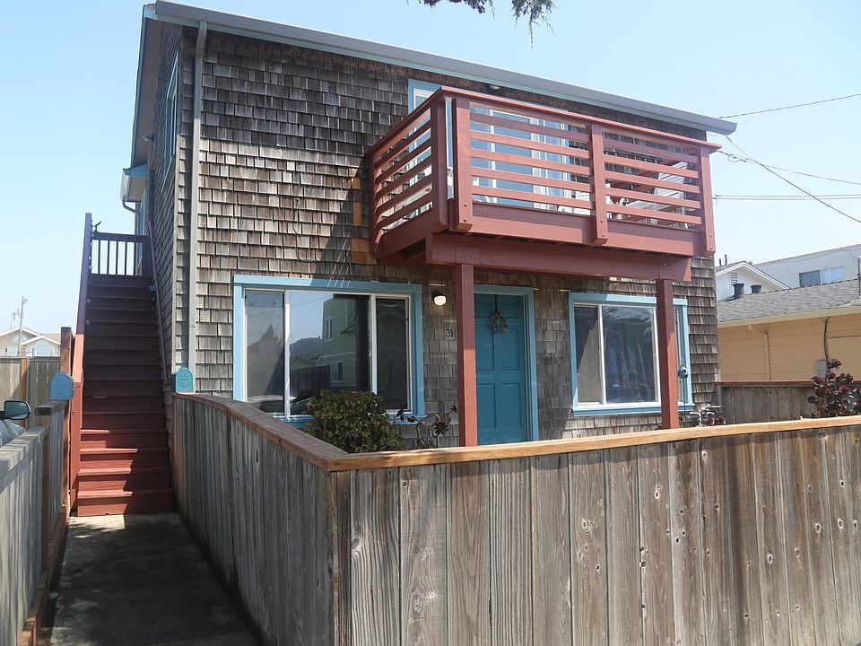 Stairs lead to the front door of upstairs 2bd/1ba