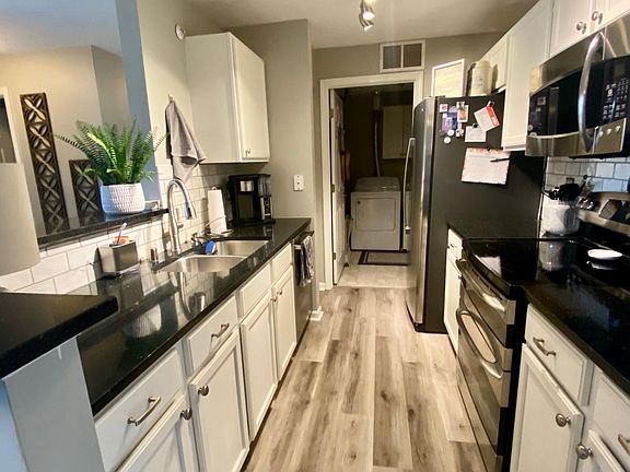 Kitchen with solid surface counters, new backsplash, newer stainless steel appliances