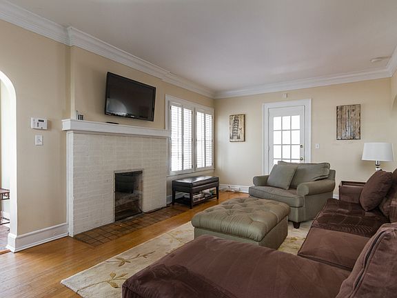 Another view of the living room with fireplace