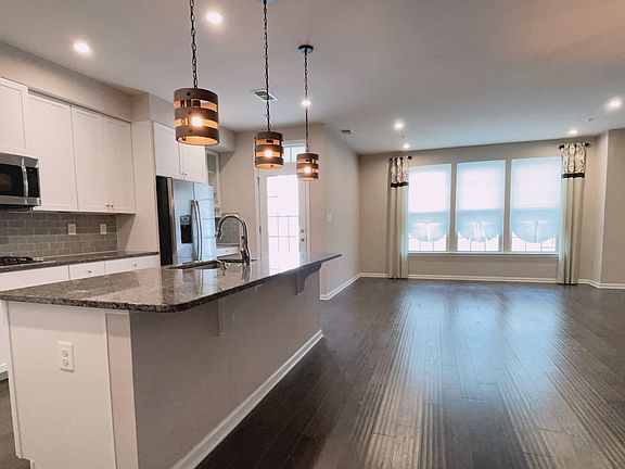 Kitchen with marble counter top and all GE stainless steel appliances