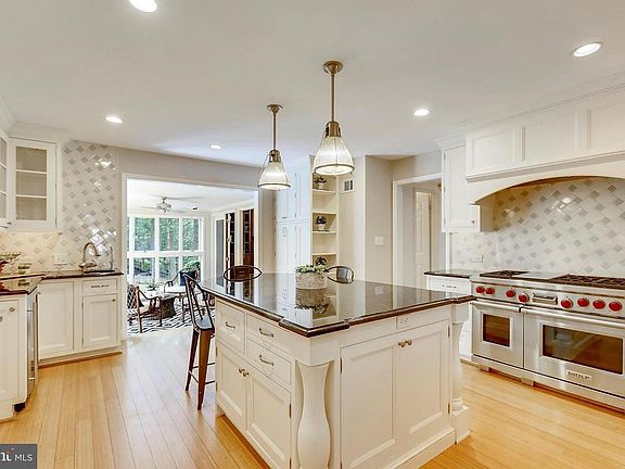 Remodeled kitchen featuring center island, wine refrigerator