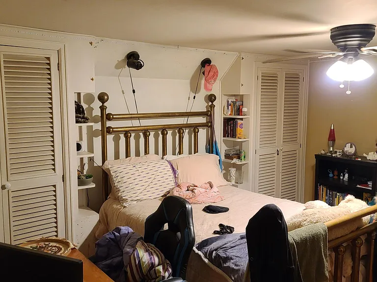 Upstairs bedroom #2, his and hers closets on ether side of a full sized bed.