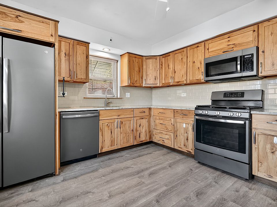 Kitchen fully updated in 2019 with granite, Amish made hickory cabinets, backsplash and new flooring