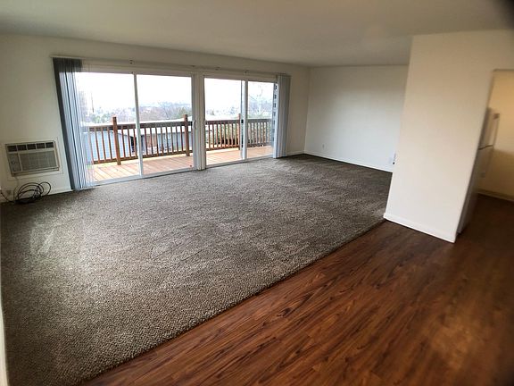Each apartment has double sliding glass doors leading from the living room to a private balcony.