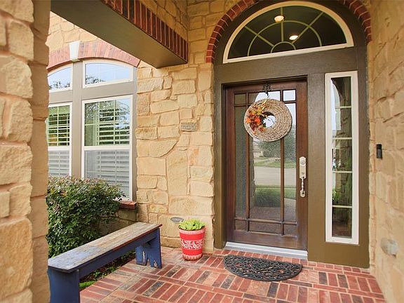 The brick & stone front porch provides an inviting welcome for your guests.