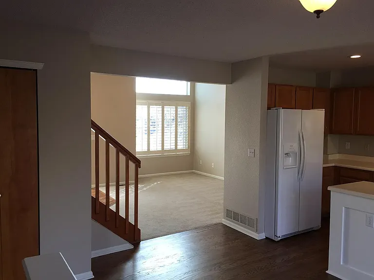 The main floor has a vaulted living room, a family room with fireplace, a beautiful kitchen with an island, pantry and all appliances, an eating area, a half bath and a laundry room with washer and dryer.