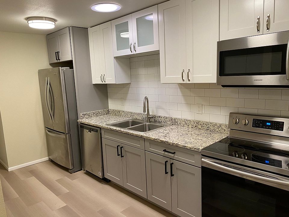Single wall galley kitchen is a highlight of this apartment home