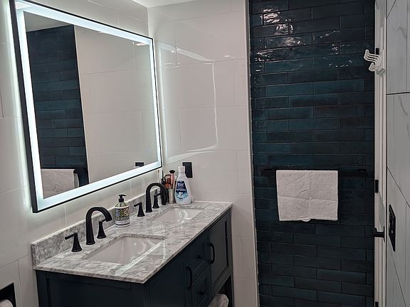 Bathroom upstairs. Double sink and rain shower
