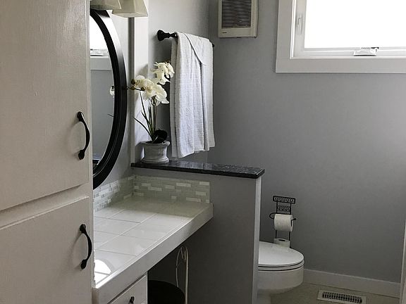 Bathroom with built-in vanity and large (original to the house) shower/tub.