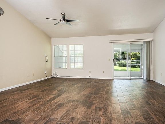 Great Room with Vaulted Ceiling - Look at those wood tile fl