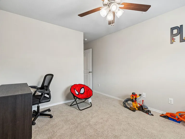 secondary bedroom with large walk in closet