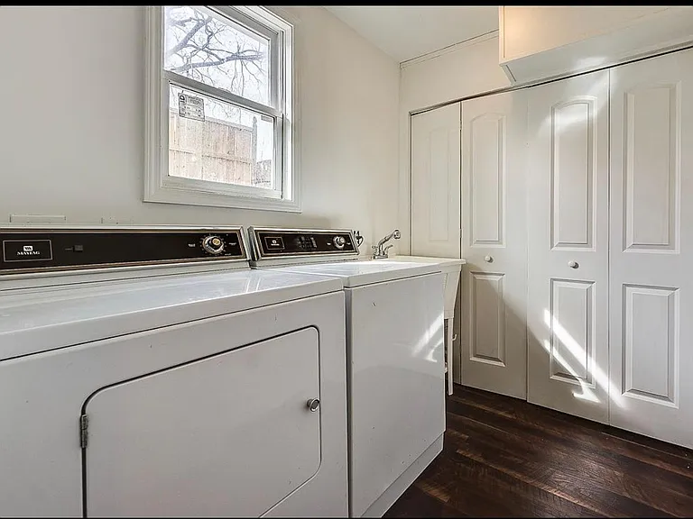 Laundry room in back is right across from room 3. There is also a door going out to backyard at end of hall
