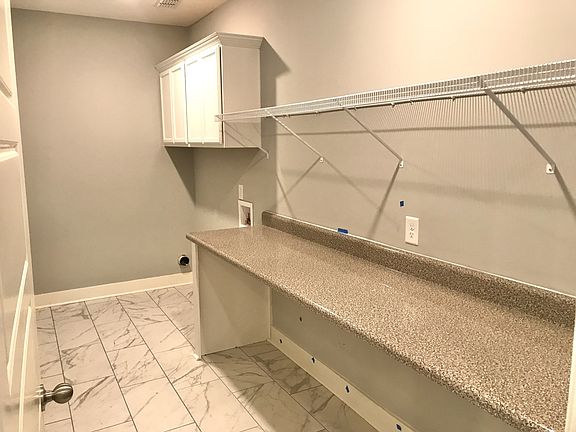 Stock photo of this plan s laundry room. Largest one we have