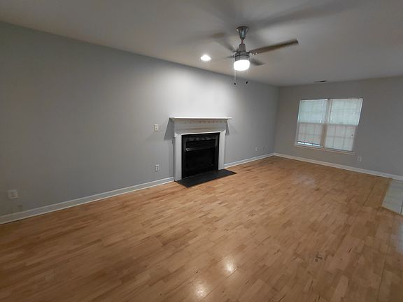 Large great room with hardwood floors and new paint