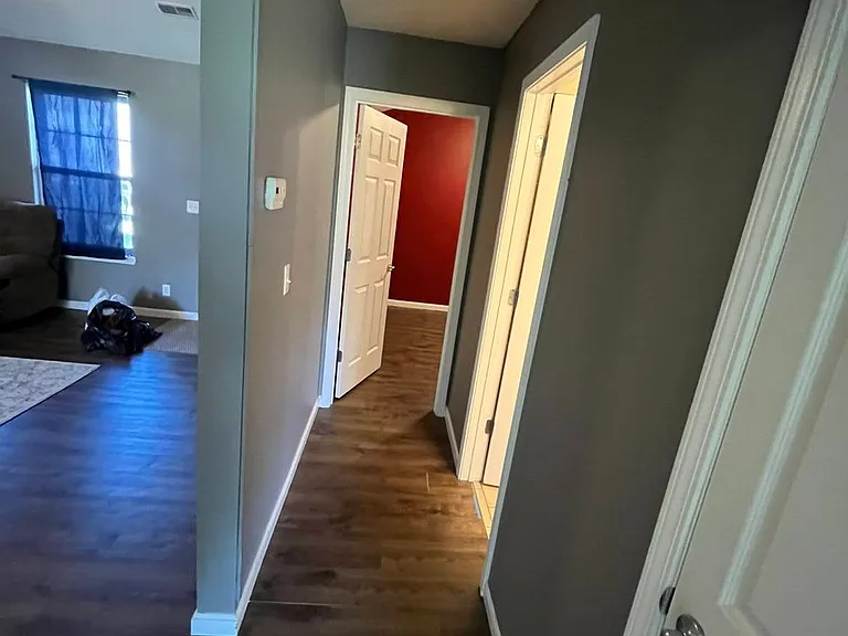 Hallway leading to 2nd and 3rd bedrooms and 2nd bathroom.