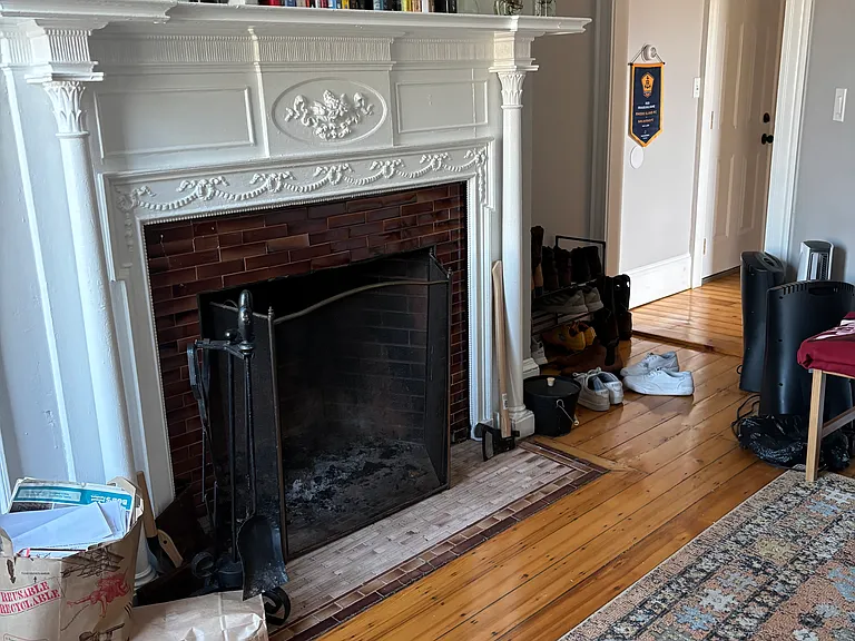 Charming 1 BR,1 bath, working FP, newly refinished original hardwood floors, large private deck, safe 2nd floor off street parking for 1 car. Excellent location with beautifully landscaped grounds. Well behaved cats and dogs ONLY; no other pets.