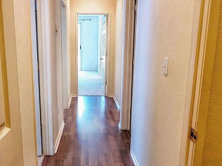 Hallway leading to the rooms.