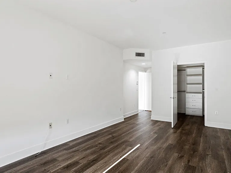 Bedroom with Closet with Built-In Shelving