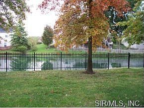 Backyard view of neighborhood pond