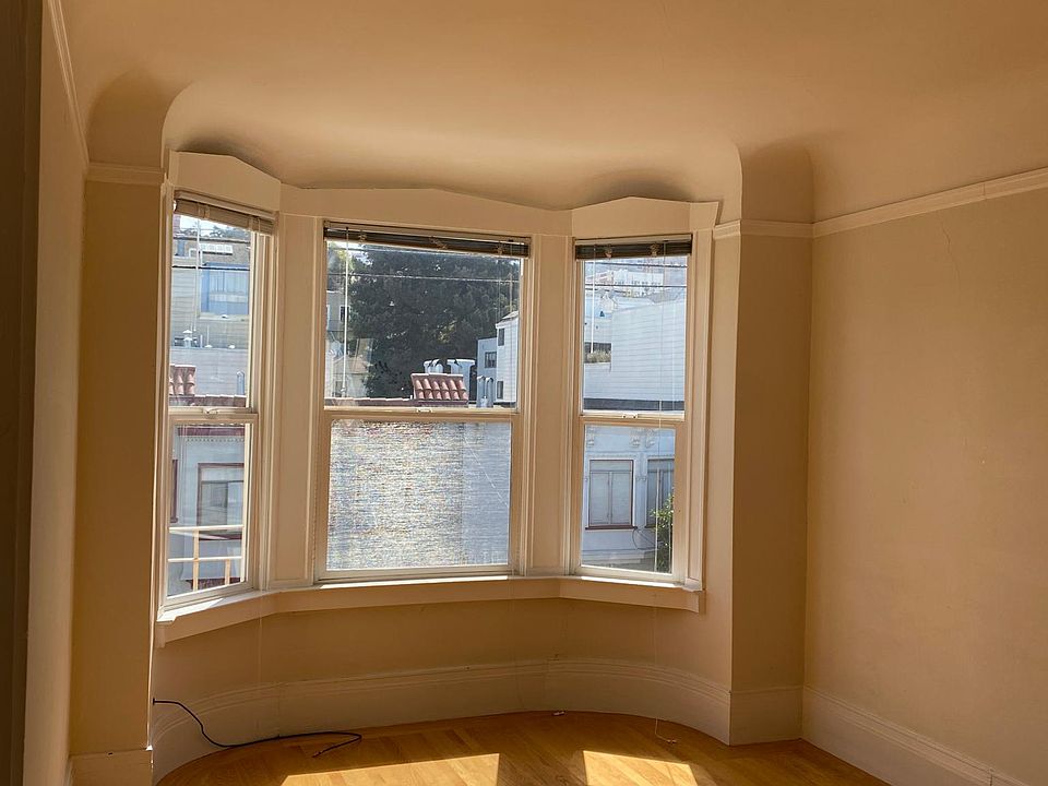 Living room- top floor unit with vaulted ceilings. Open concept leads into bedroom or office