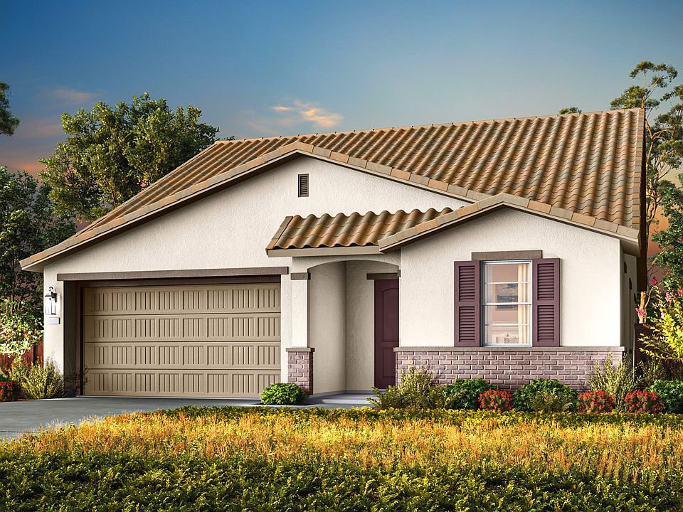 A single-story house with a tiled roof sits in a well-landscaped yard, surrounded by lush greenery a