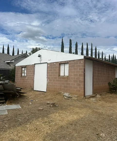 block bard wood shutters new framing and steel roof. all doors and windows