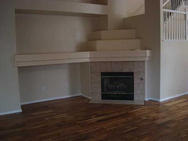 Other side of family room showing fireplace and new flooring