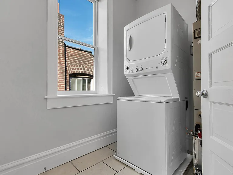 Laundry Room - full size stacked washer & dryer
