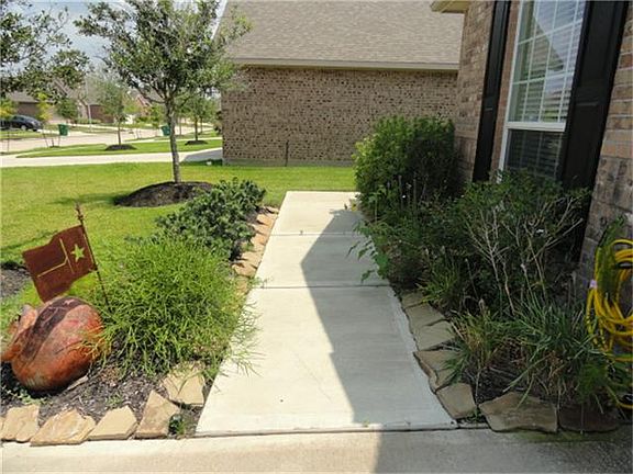  Nice landscaping enhances the front elevation.