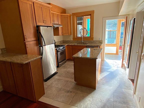 Sweet Kitchen! Stainless, granite, custom tile.