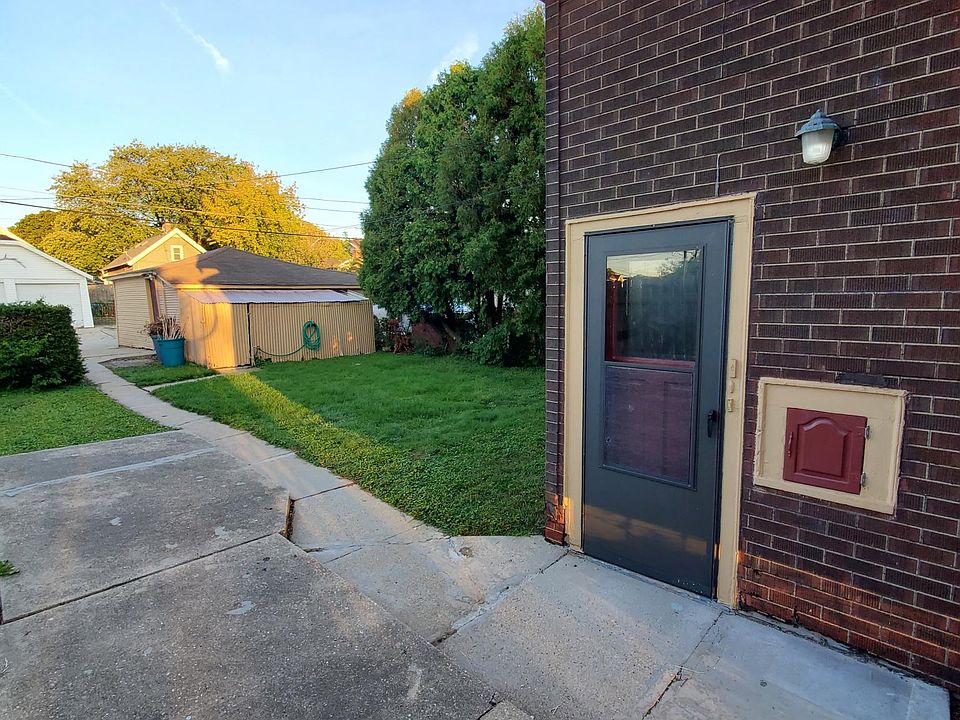 Upper unit side door and garage/alley