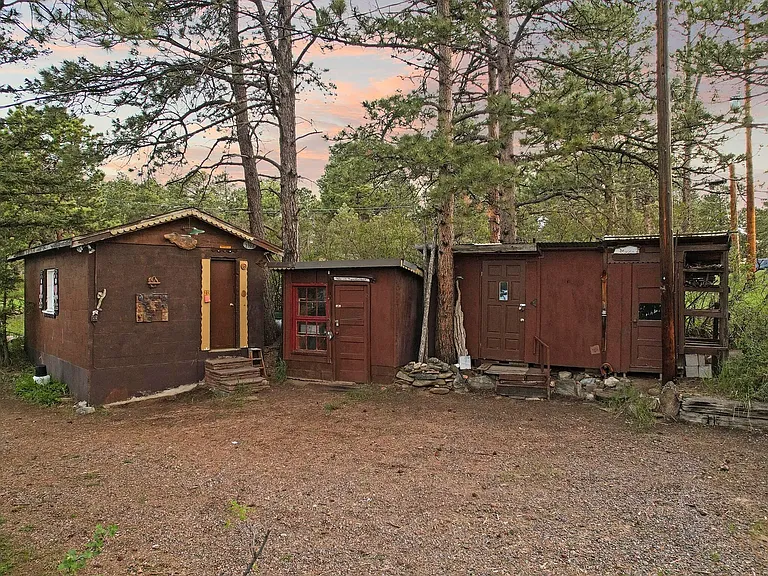 One-car garage and 2 sheds for storage or workshop space