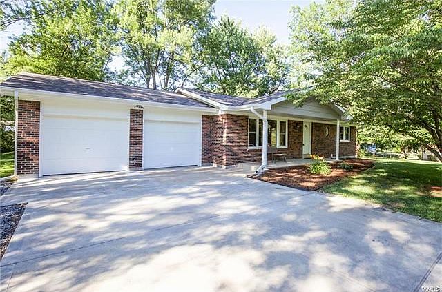 ALL NEW Driveway, soffits, fascia, windows, roof, pillars, front door, and landscaping.