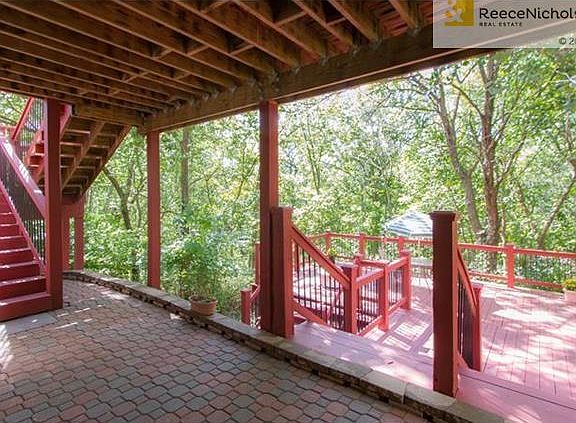 From lower level, walk out onto a covered paver stone patio.