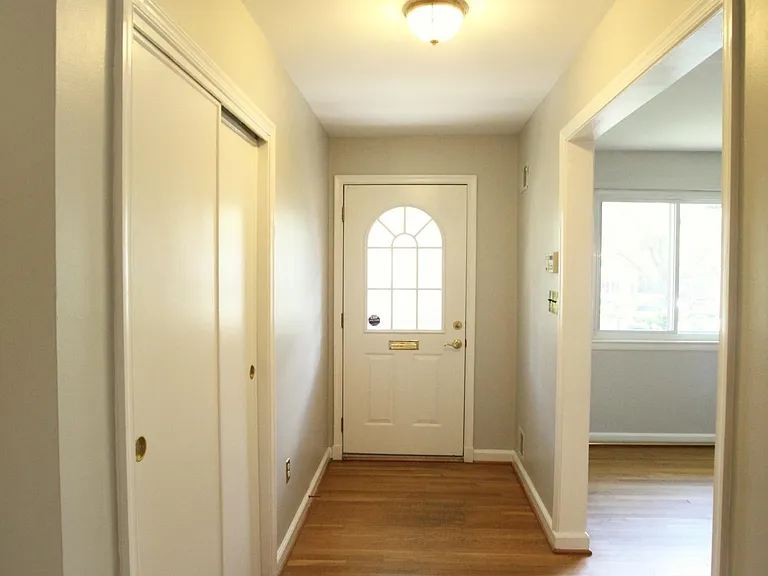 Entrance hallway, living room is on the right