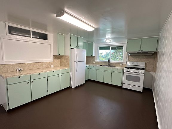 Large kitchen has lots of storage and newer applicances.