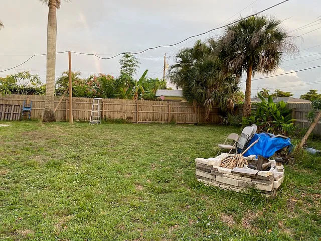 Large Fenced-in Backyard with Fire Ring and Gates on each side of the House.