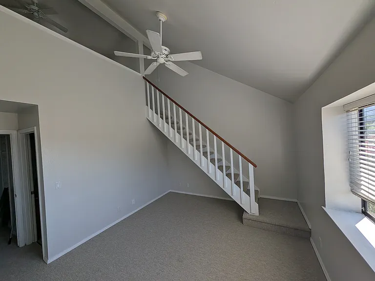 bedroom with stairs to loft