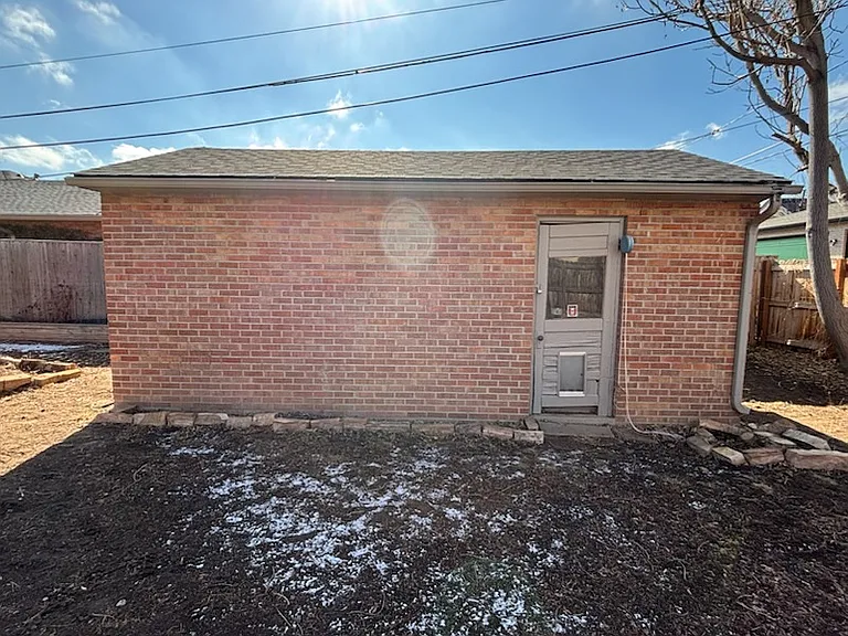 Sizable storage garage side entry.