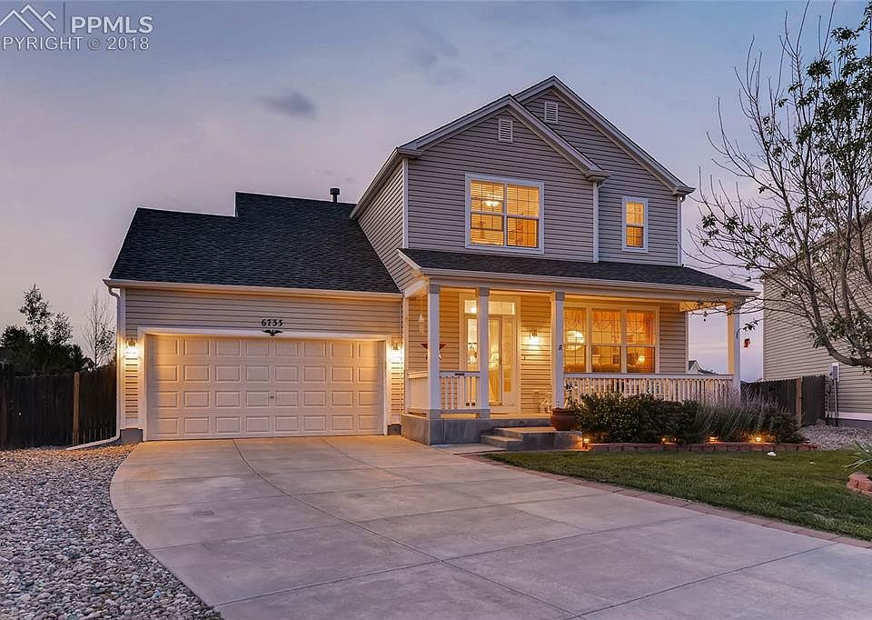 Beautiful front of home with large driveway
