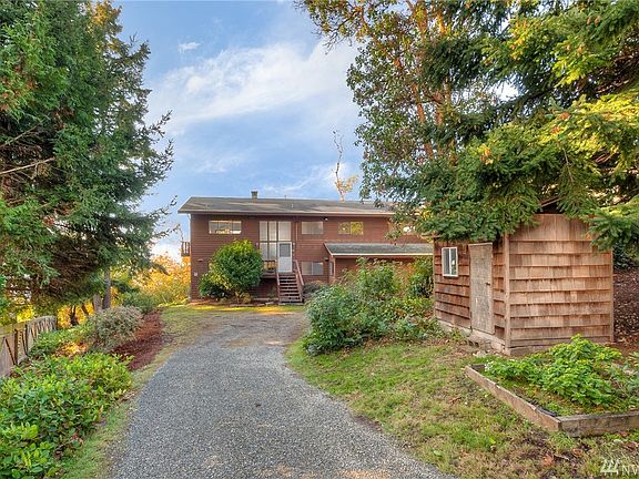 First time on the market for this custom built, high bank waterfront home in beautiful Normandy Park! The outbuilding was used as a playhouse!  Great for storing garden tools too.