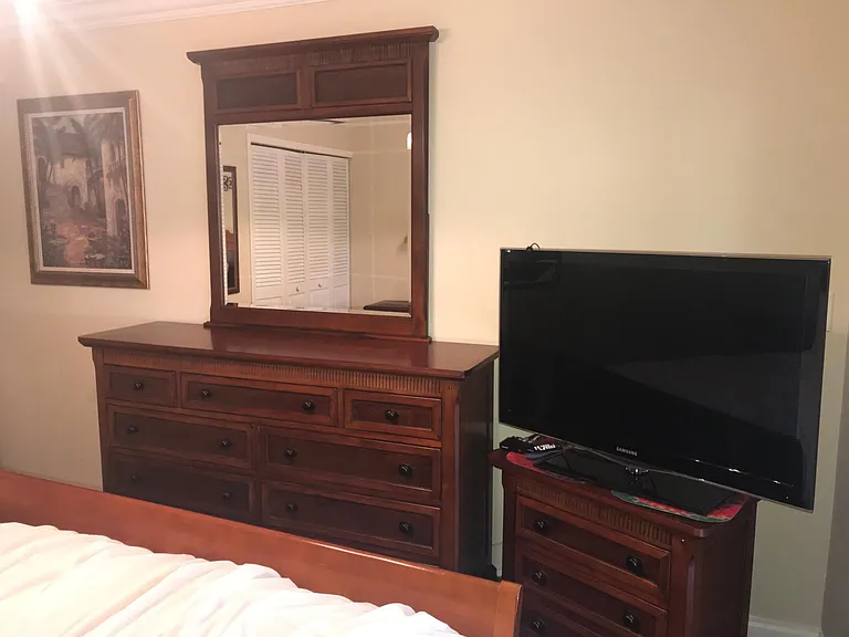 2nd bedroom has dresser and smart TV